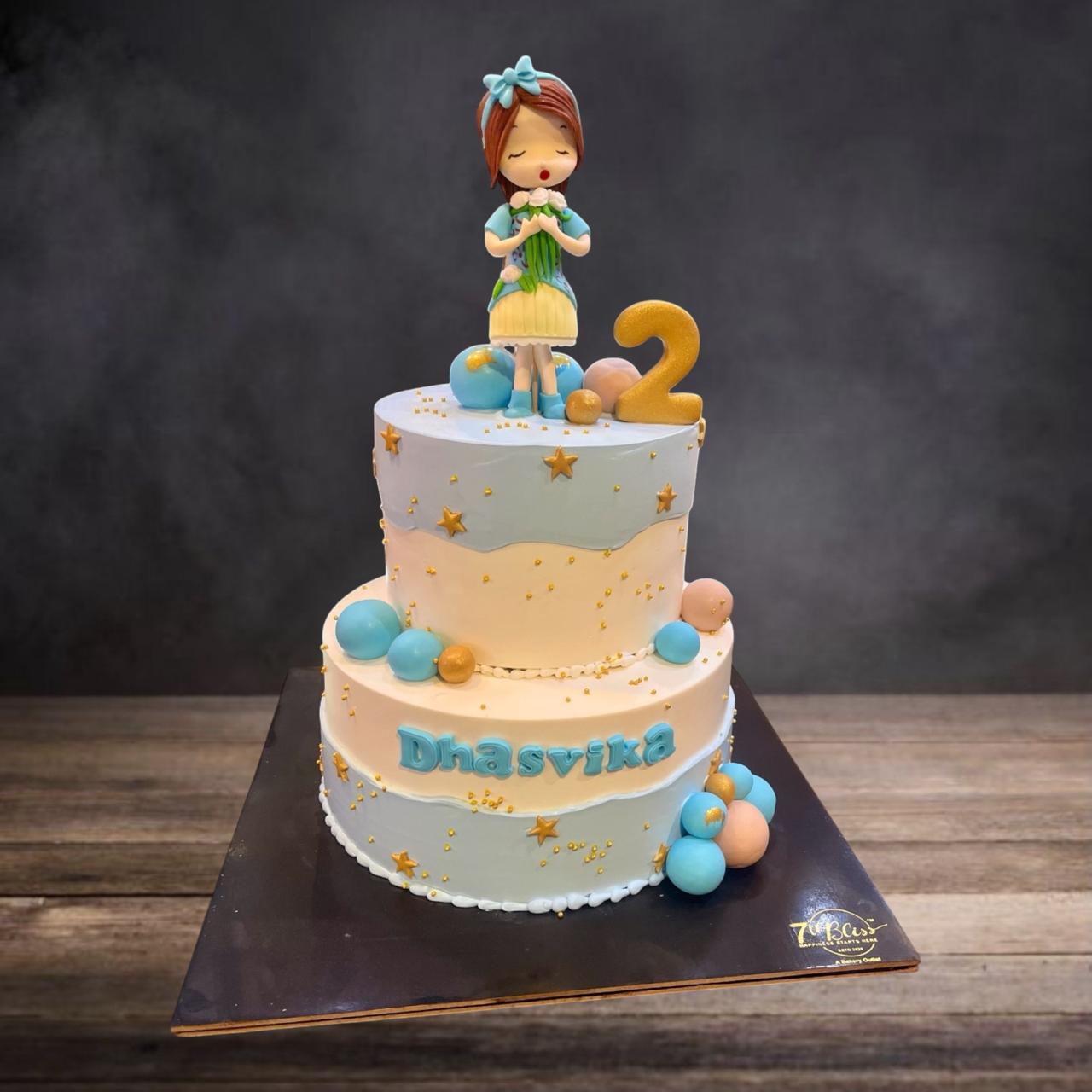 Pastel Blue Doll Theme Tier Cake